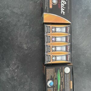 Titleist Golf Balls in Black and Orange Packaging